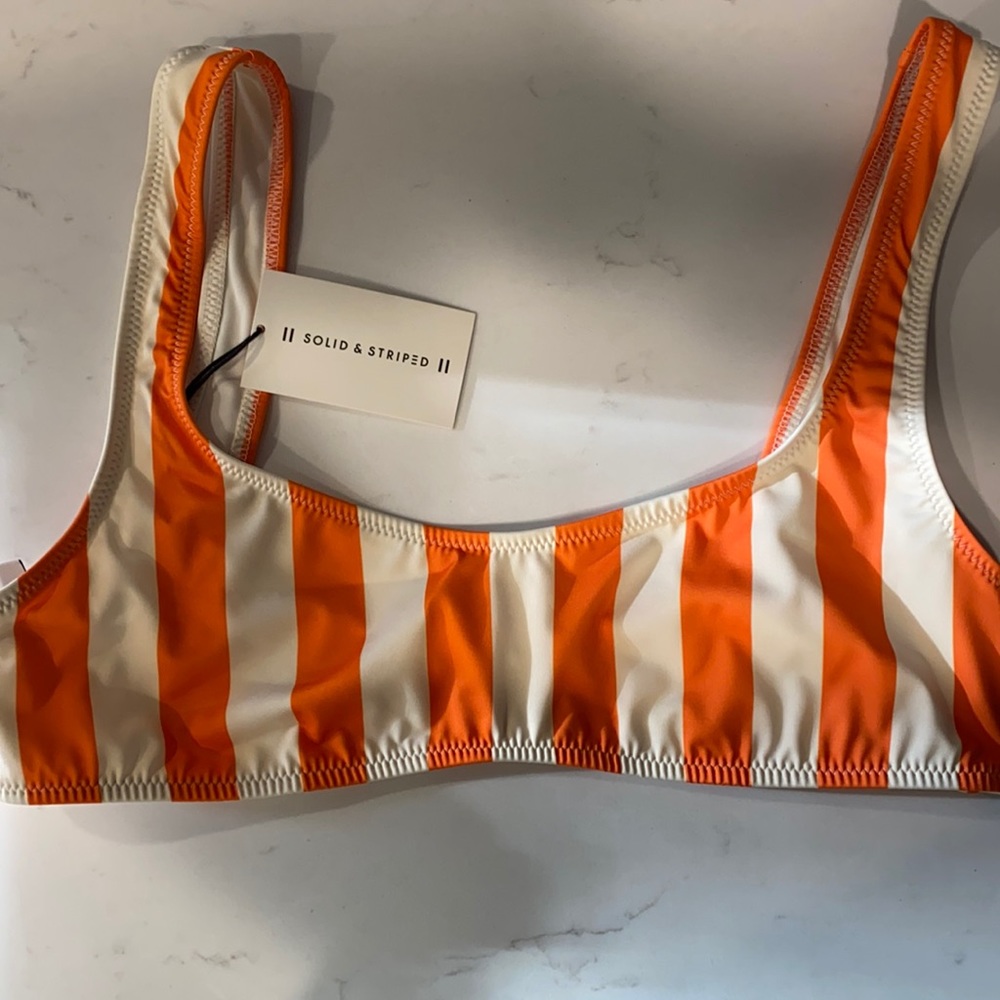 Size large solid and striped bikini top